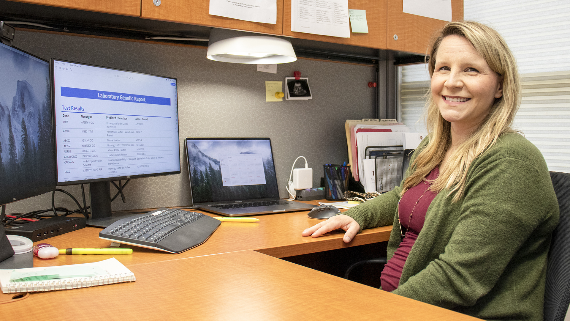 Dr. Alexander sitting at the desk in her office