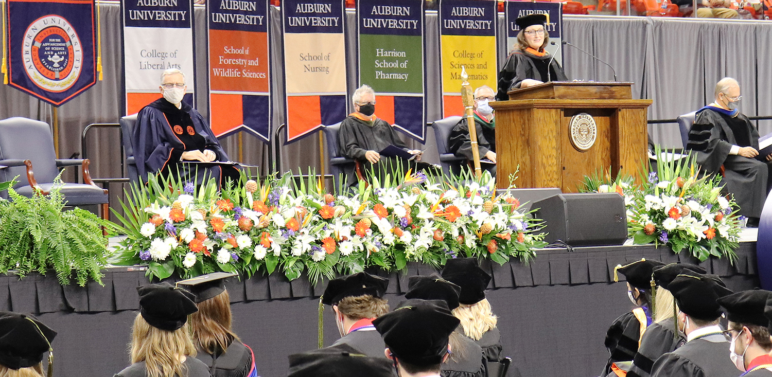 Laura Matthews speaks from a stage