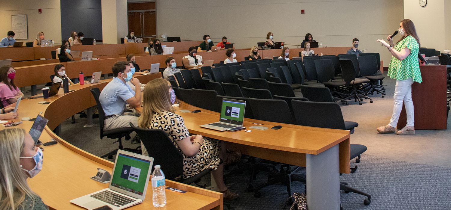 Faculty member talks to class