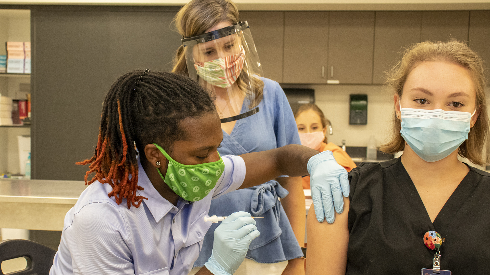 Student gives an injection