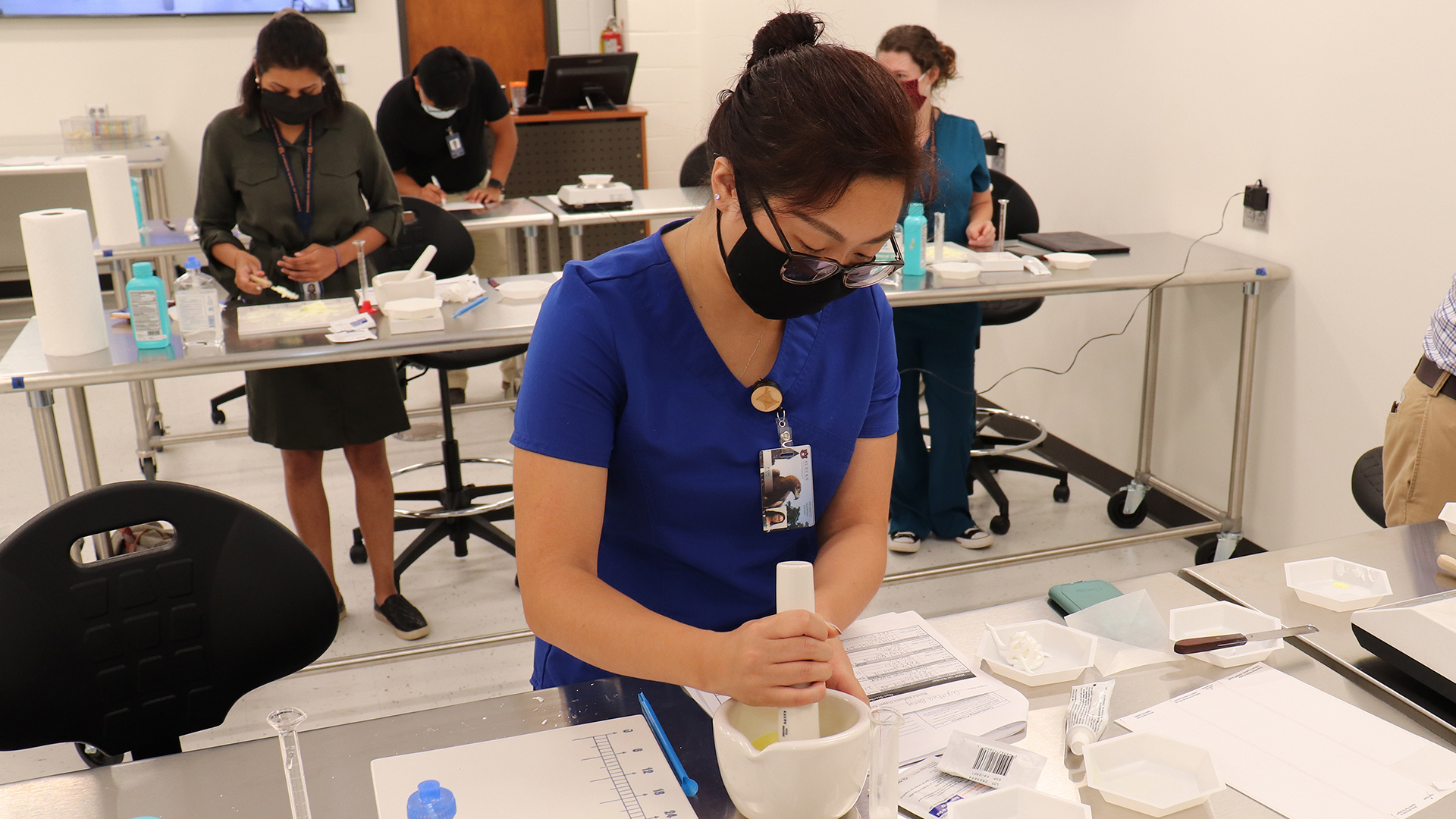 Student uses mortar and pestle
