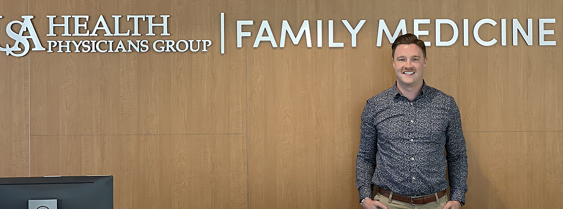 Dr. Kevin Astle stands at his clinic