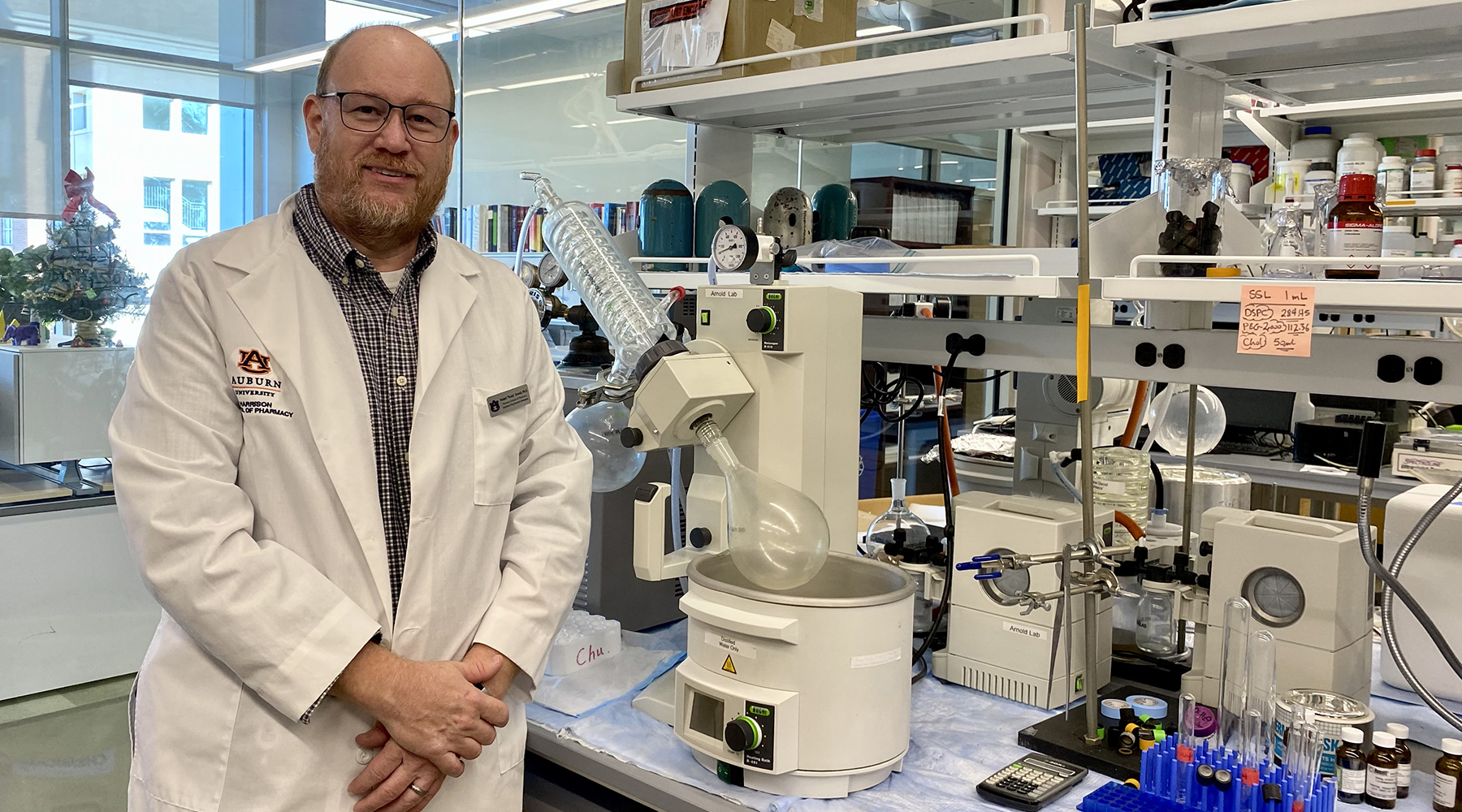 Dr. Arnold stands in his lab