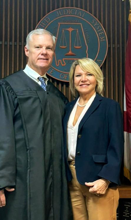 Stacy Giles stands with court justice