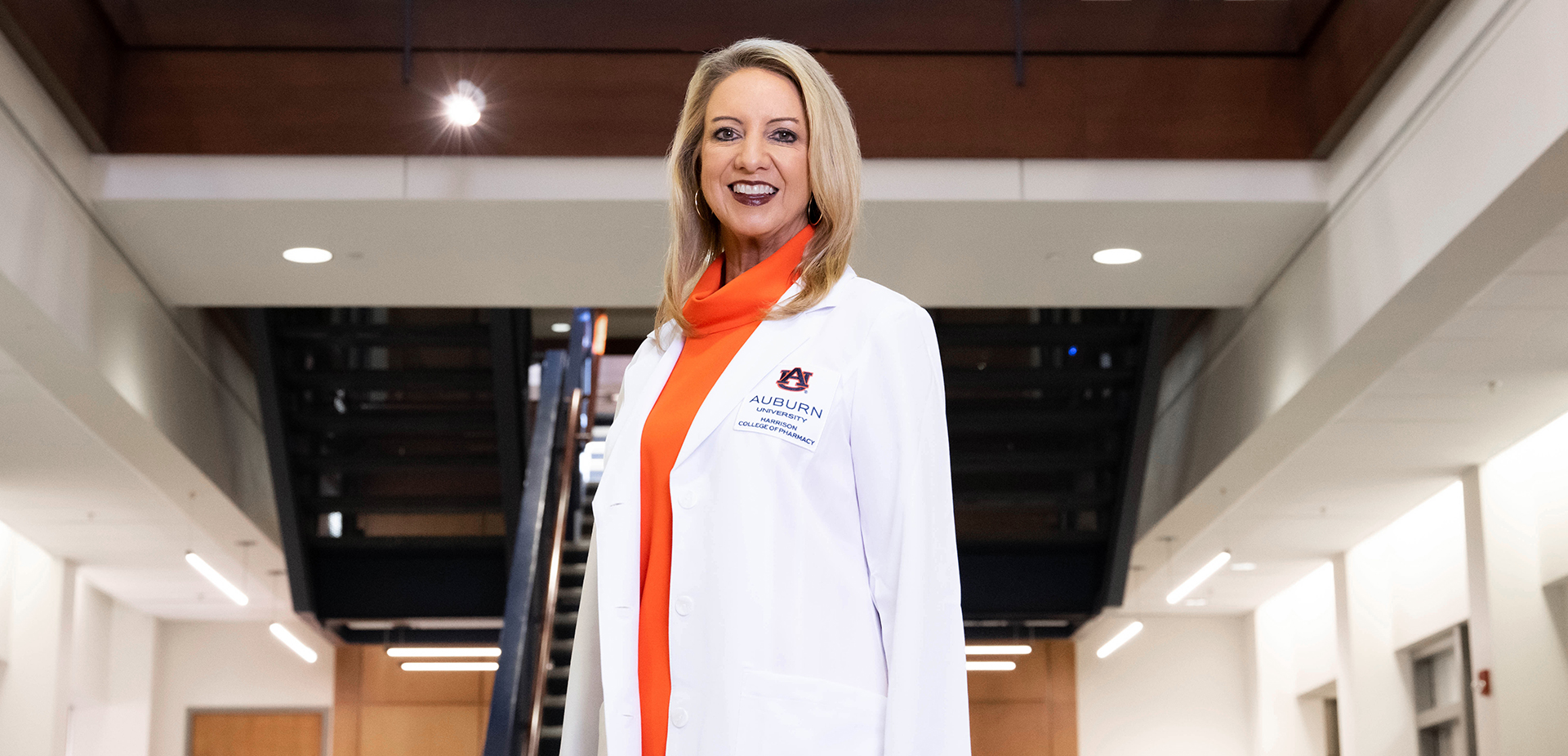 Leigh Ann Ross stands in atrium